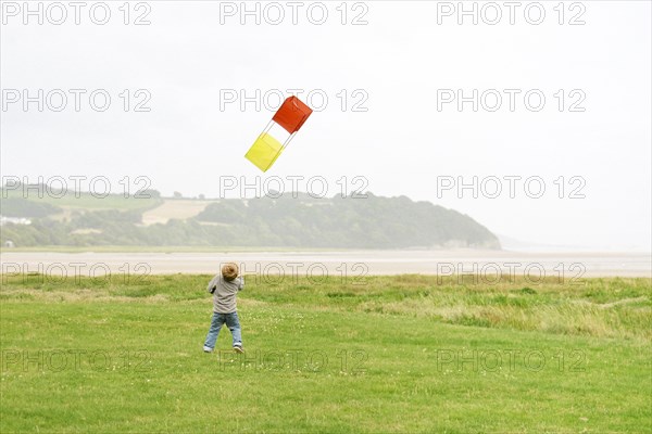 Young Boy Flying Kite