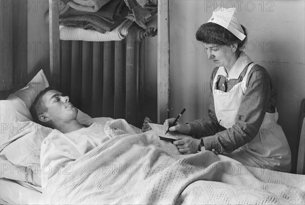 Nurse writing a Letter Home for a wounded American Soldier at the American Military Hospital No. 1