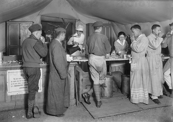 American Soldiers en route to the front being served daily with Coffee and Doughnuts at the American Red Cross Canteen
