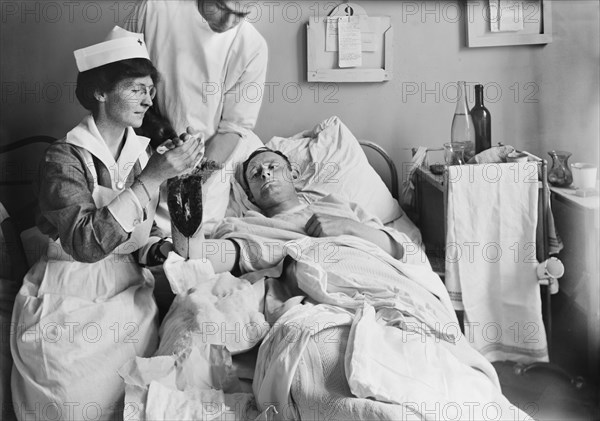 Nurse Dressing Wound of Injured American Soldier at Military Hospital I