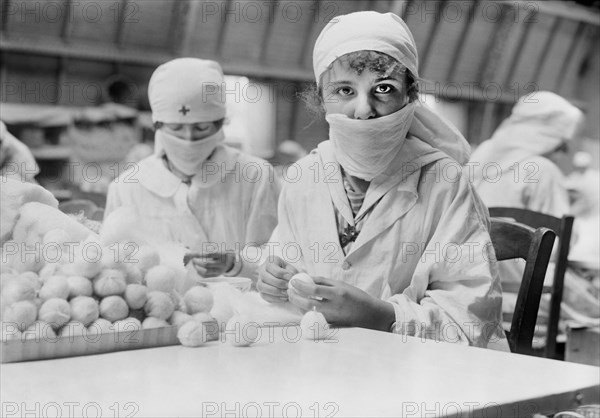 Two French Women making Cotton Balls for the Front Parcel at the American Red Cross Workrooms for Surgical Dressings