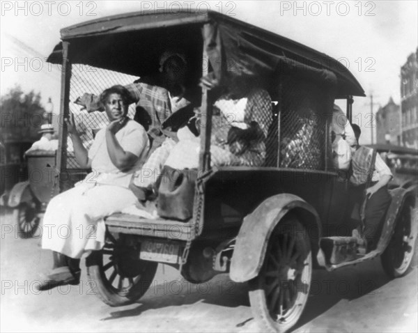 Rear View of Truck carrying African Americans during Riot