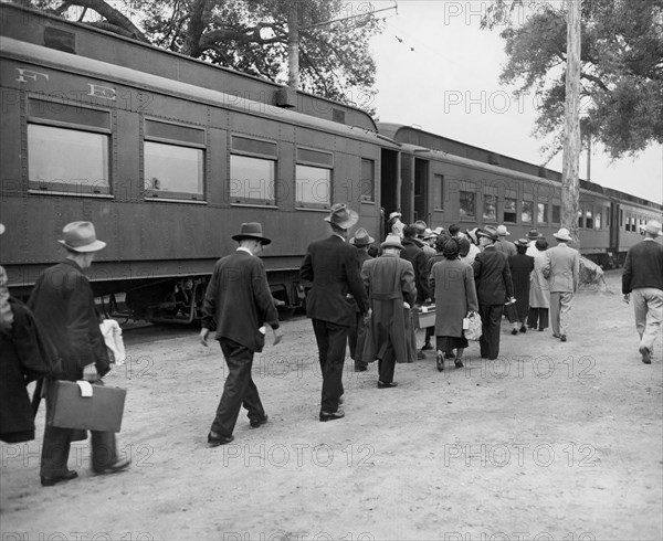 Evacuees boarding Special Train at Assembly Center enroute to a War Relocation Center