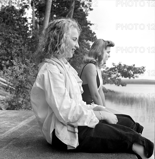 Two Girls drying their Hair after Swim