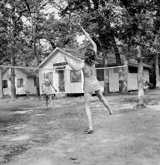 Two Girls playing Badminton