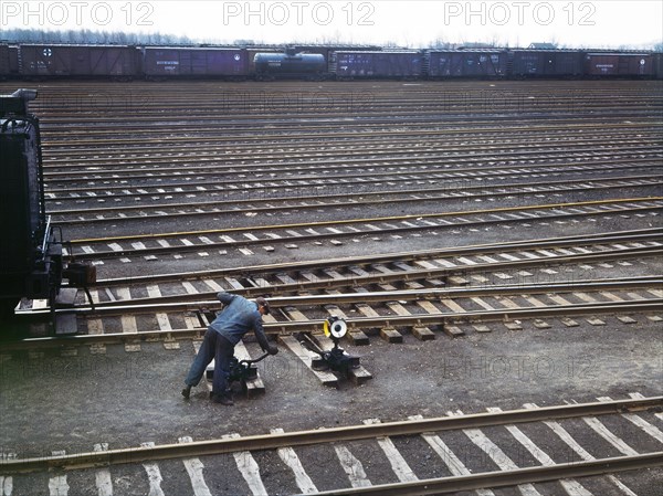 Switchman throwing a switch at Chicago and North Western Railroad's Proviso Yard