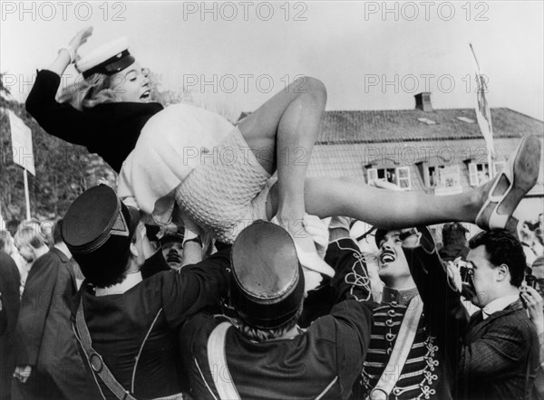 Actress Pia Degermark being lifted in the air during Graduation Ceremonies at the Exclusive Sigtunaskolan