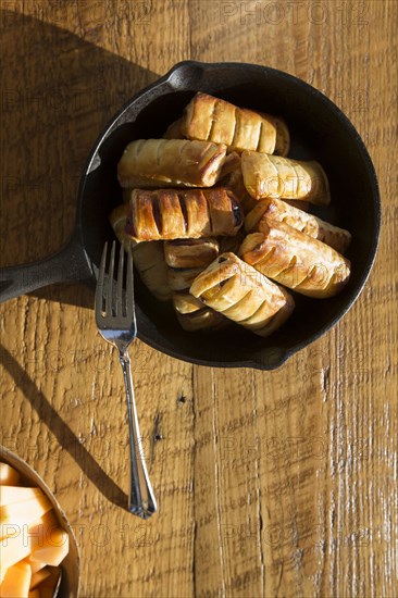 High Angle View of Apple Pastries with Fork in Cast Iron Skillet