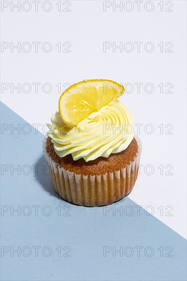 Lemon Cupcake on Blue and White Background