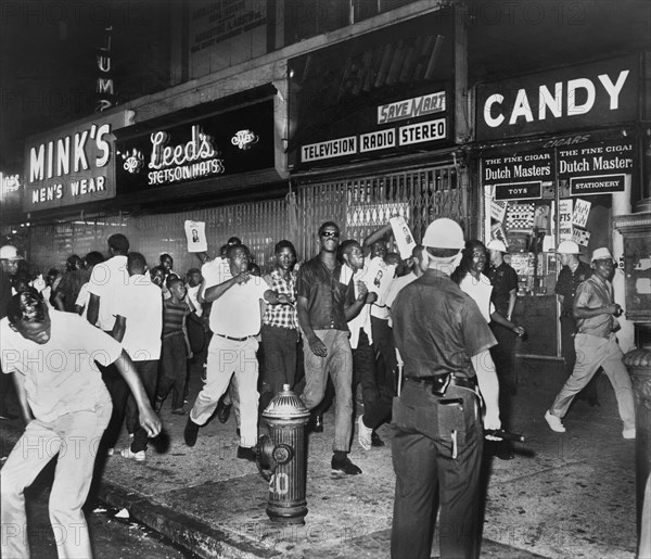Fatal shooting of Teen James Powell by Police Officer Lt. Thomas Gilligan, stirred African American rioters to race through Harlem streets carrying pictures of Lt. Gilligan, July 1964