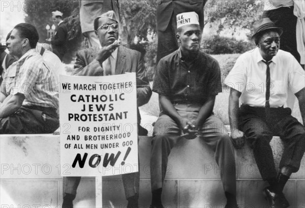 Participants in Selma to Montgomery Civil Rights March resting on Wall, Alabama,