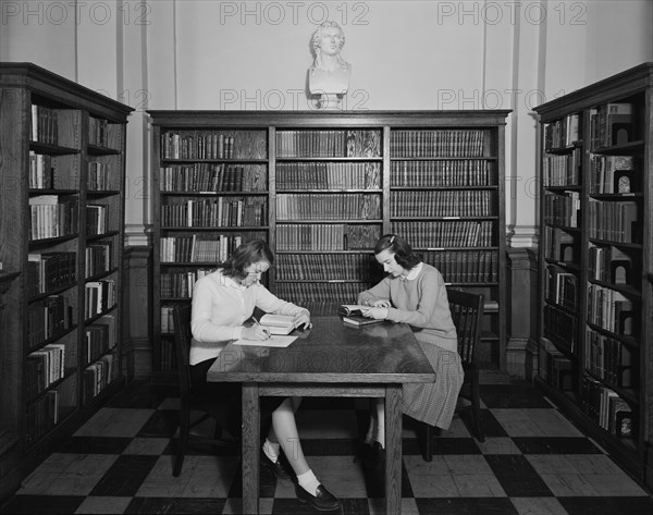 Two Students studying in Library, Trinity College (Trinity Washington University), 1952