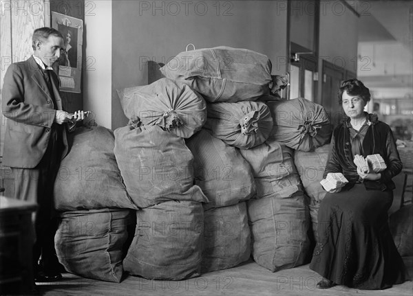 Supt. Marvin McLean and Mrs. Clara R.A. Nelson with Bags of Dead Letter Mail, U.S. Post Office, October 1916
