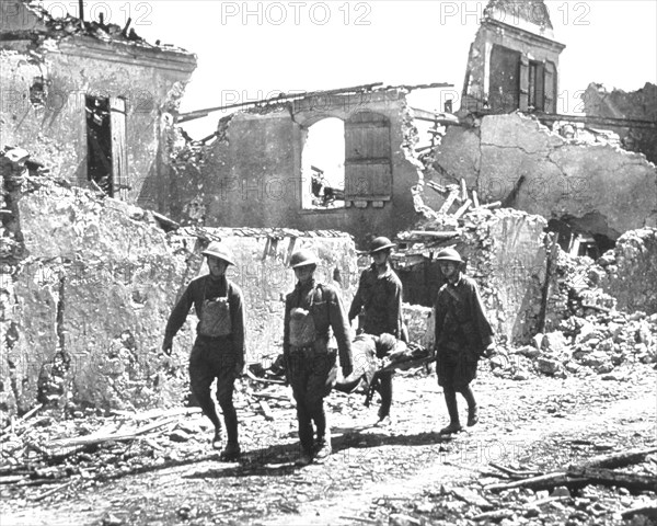 Four Soldiers carrying Wounded Soldier on Stretcher past Bombed-out Building, Vaux, 1918