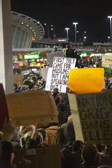 Crowd holding Signs at Protest against Muslim Travel Ban, JFK Airport,