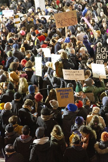 High Angle View of Crowd holding Signs at Protest against Muslim Travel Ban, JFK Airport,