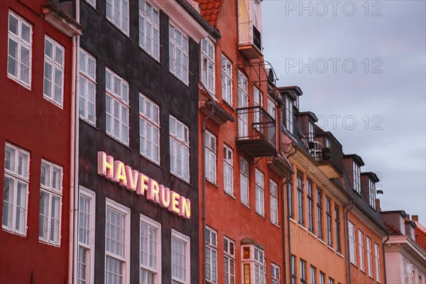Havfruen Neon Sign on building at Sunset, Copenhagen,