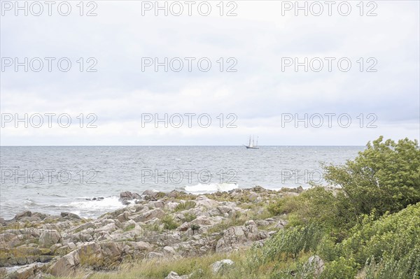 Wooden Sailboat off Rocky Beach, Bornholm,