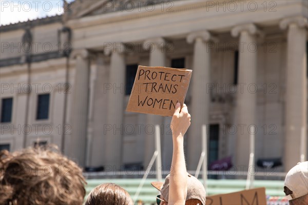 Protester holding up Protect Trans Women Sign during Protest outside Brooklyn Museum, Brooklyn,