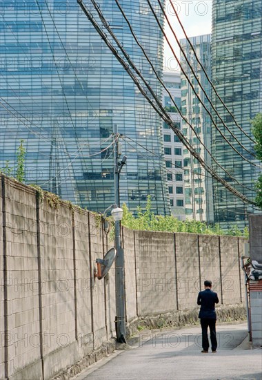 Rear View of Man standing on Street, Seoul,