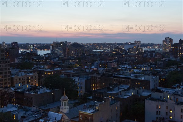 Cityscape at Dusk, Hudson River in Background,