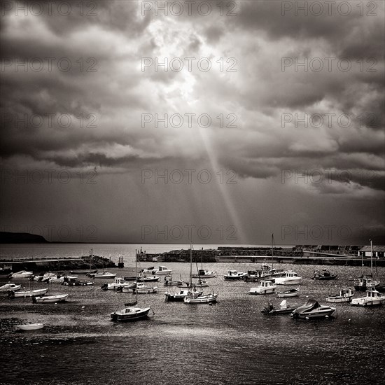 Light Ray through Dramatic Clouds over Harbor, Portrush,