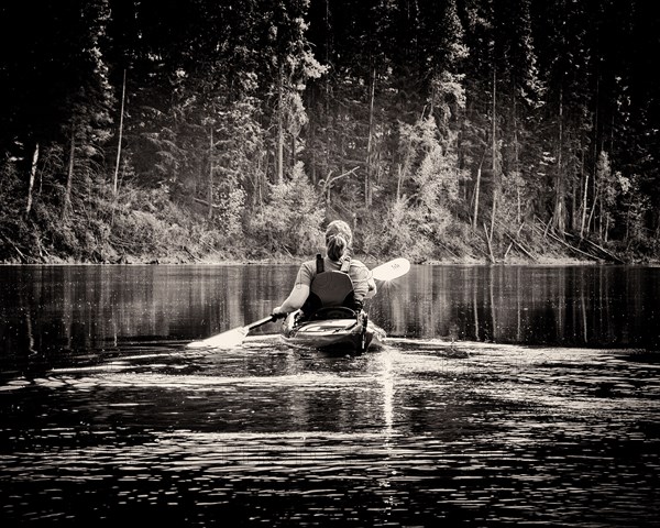 Rear View of Woman Kayaking,,