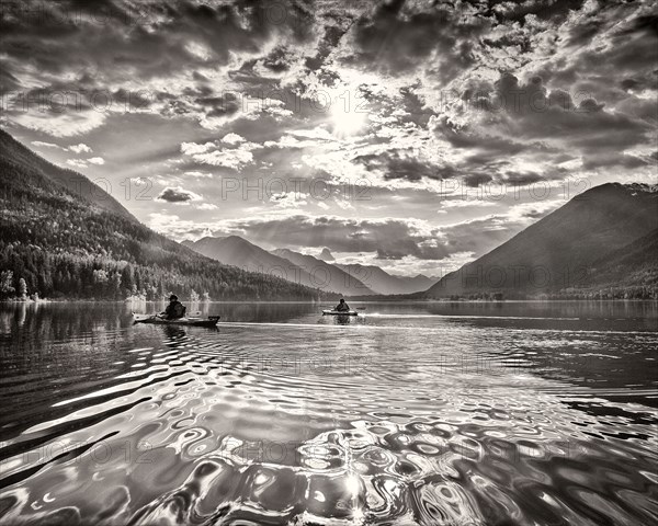 Two Kayakers on Lake with Dramatic Sky,,