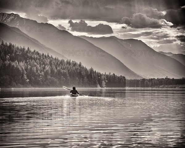 Rear View of Woman Kayaking,,