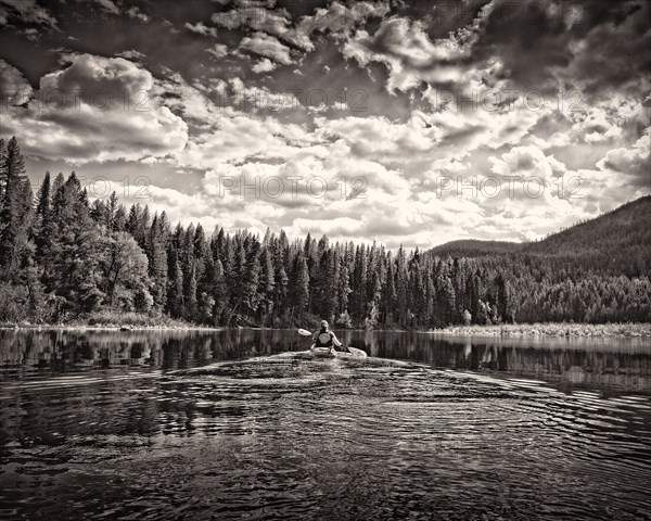 Rear View of Woman Kayaking,,