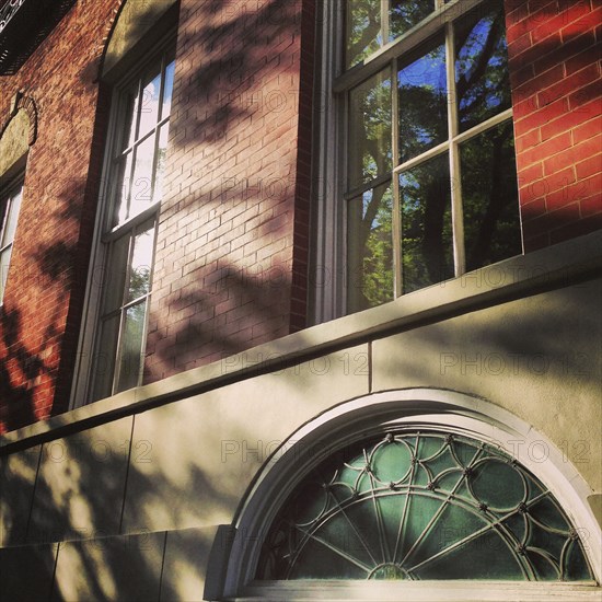 Shadows on Urban Brick Building Exterior,,