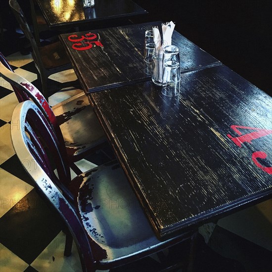 High Angle View of Restaurant Table and Metal Chairs,,