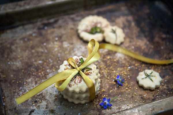 Small Stack of Shortbread Cookies with Bow Tie, Edible Flowers and Gold Sugar,