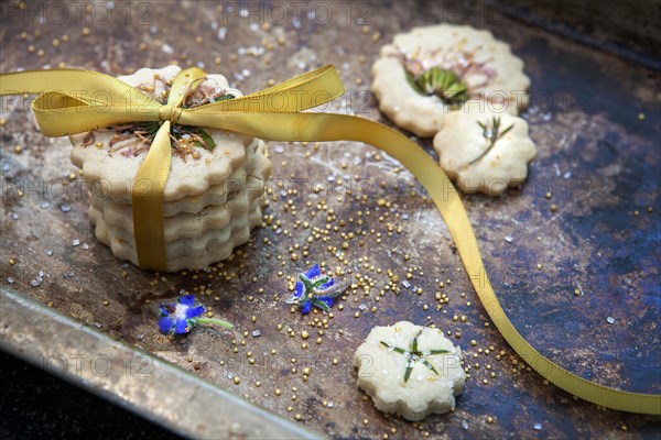 Small Stack of Shortbread Cookies with Bow Tie, Edible Flowers and Gold Sugar,
