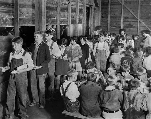 American Red Cross Volunteers cooking and serving Lunch to Rural Schoolchildren, all Drought Victims