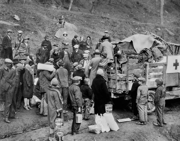 all Drought Victims in isolated Mountain Community, receiving Food Orders from American Red Cross