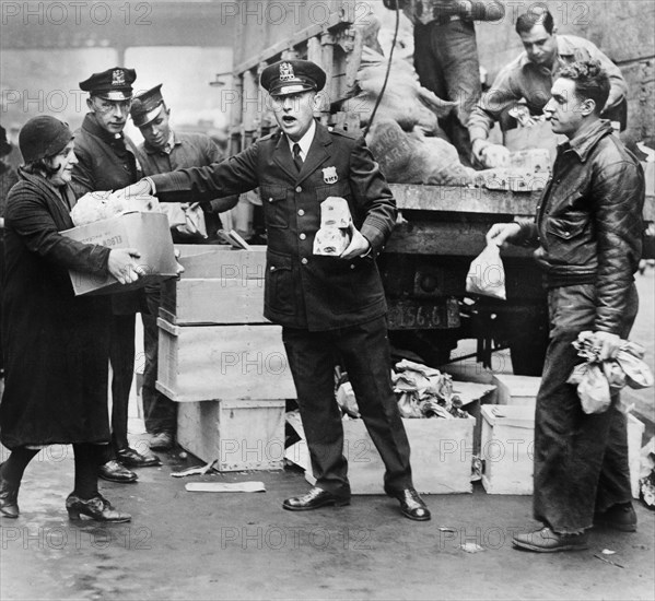 Police distributing Eggs and Bread to City's Needy at East 104th St. Station House, New York City