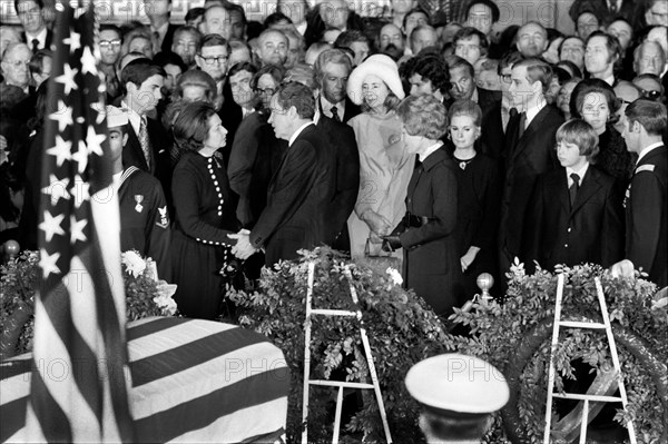 U.S. President speaking with Claudia "Lady Bird" Johnson during former U.S. President Lyndon Johnson's Funeral inside Capitol Building, Washington