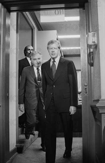 U.S. President Jimmy Carter walks with members of the Three Mile Island Commission, Washington D.C.