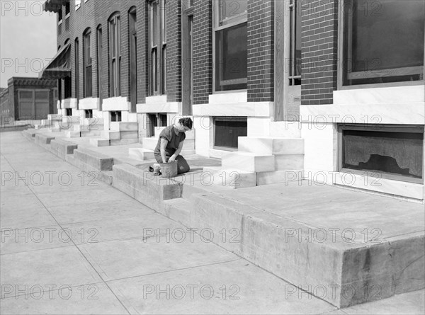 Woman scrubbing White Steps, Baltimore