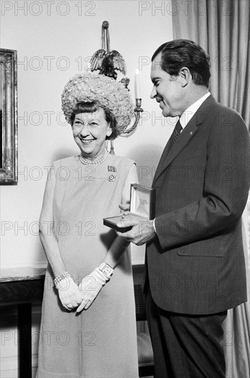 U.S. President Richard Nixon with former First Lady Mamie Eisenhower during Eisenhower Dollar Presentation, White House