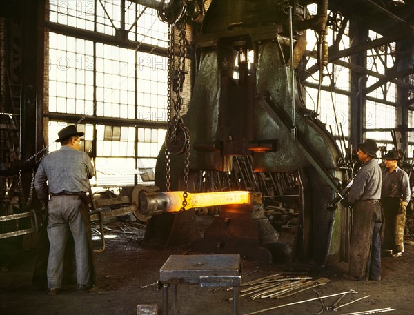 Workers hammering out Draw Bar on Steam Drop Hammer in Blacksmith Shop