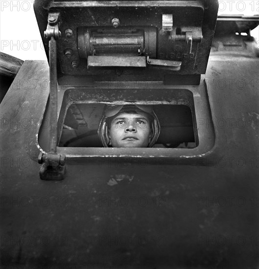 Sergeant George Camblair learning to drive a Tank