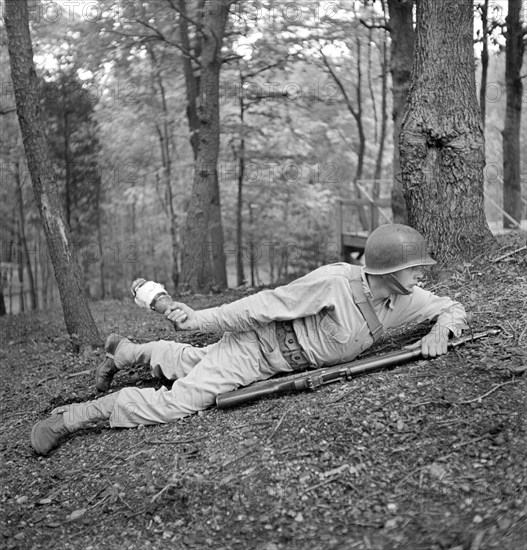 Sergeant George Camblair learning how to use a "Molotov Cocktail"