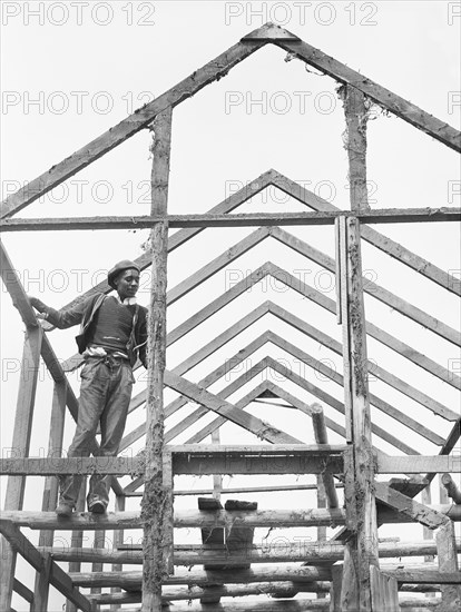 Man Rebuilding his Home outside the area of Santee-Cooper Basin