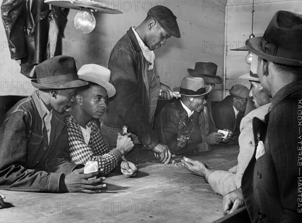 Men spending their money in Gambling and Juke Joint