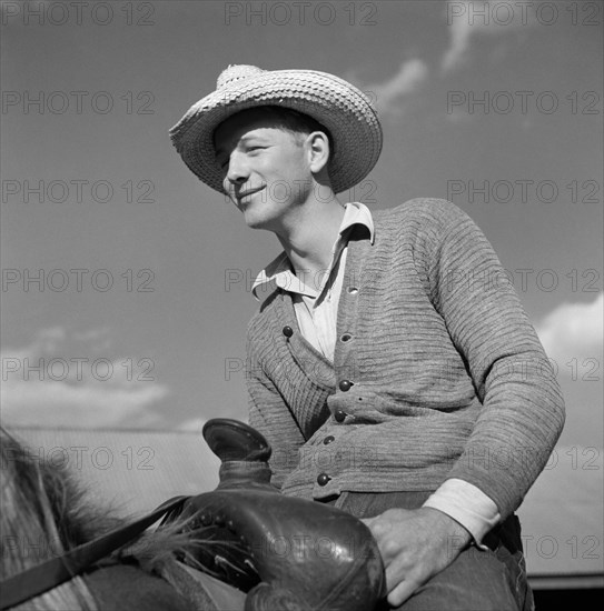 Cowboy on Ranch Horse in Corral at Quarter Circle U
