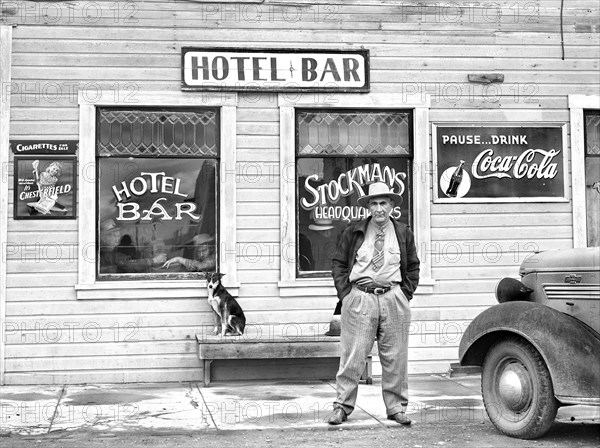 Man standing in front of Hotel Bar