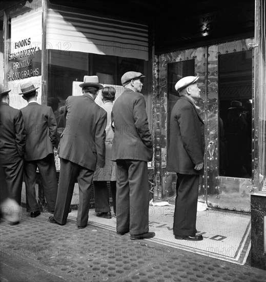 Group of Chinese Men reading News of the Surrender of Canton to the Japanese