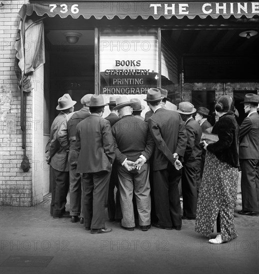 Group of Chinese Men reading News of the Surrender of Canton to the Japanese